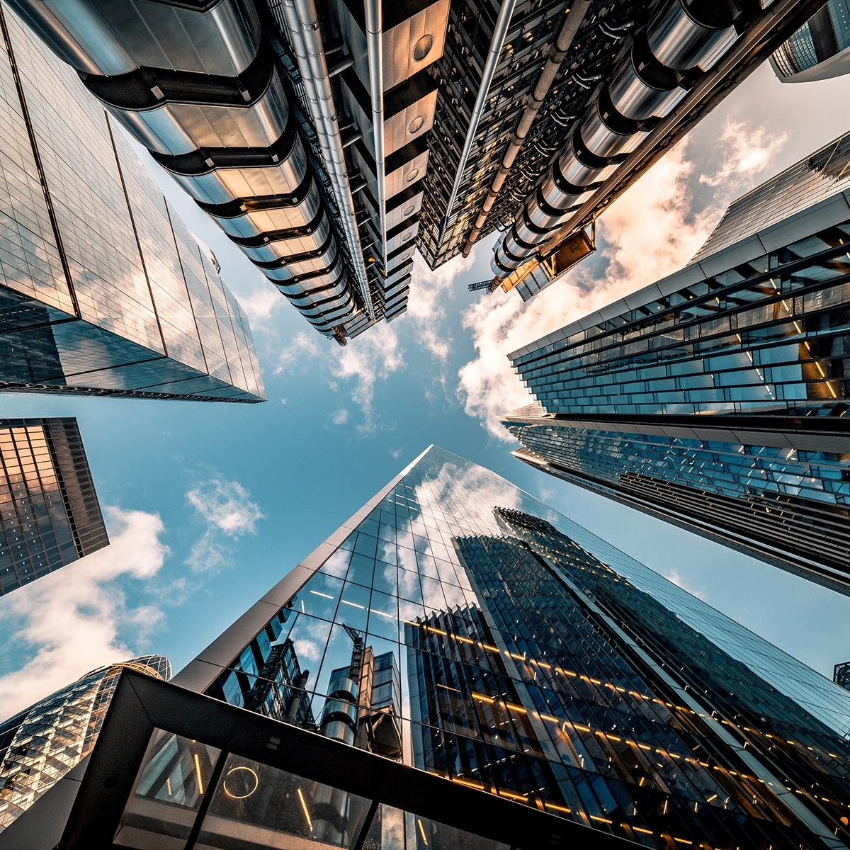 View from below of city skyscrapers on a clear sunny day